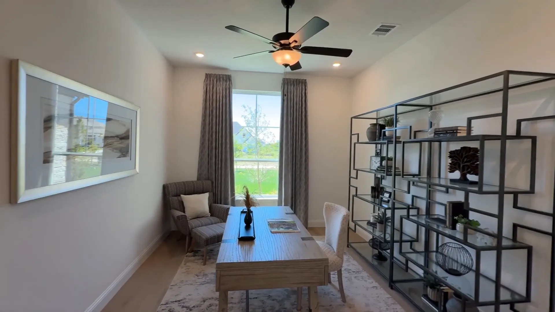 Home office with glass shelving in Kindred Homes Sperry model