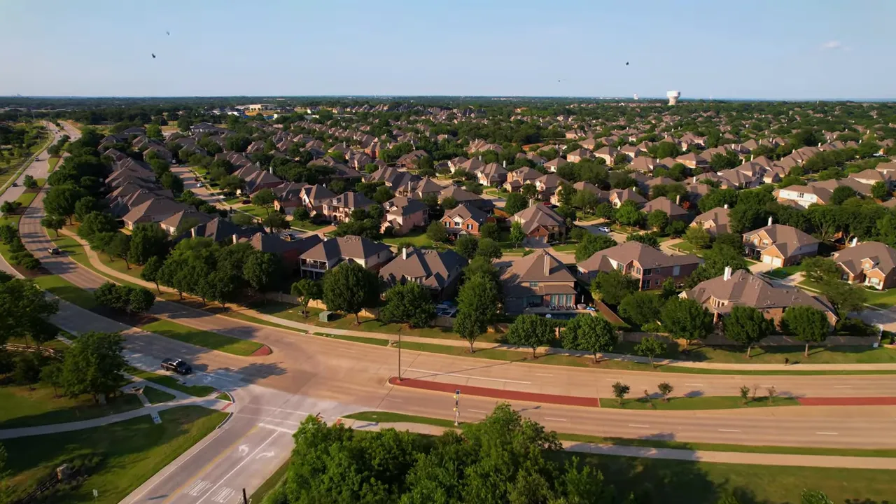 Aerial view of a North Texas neighborhood showing homes and streets