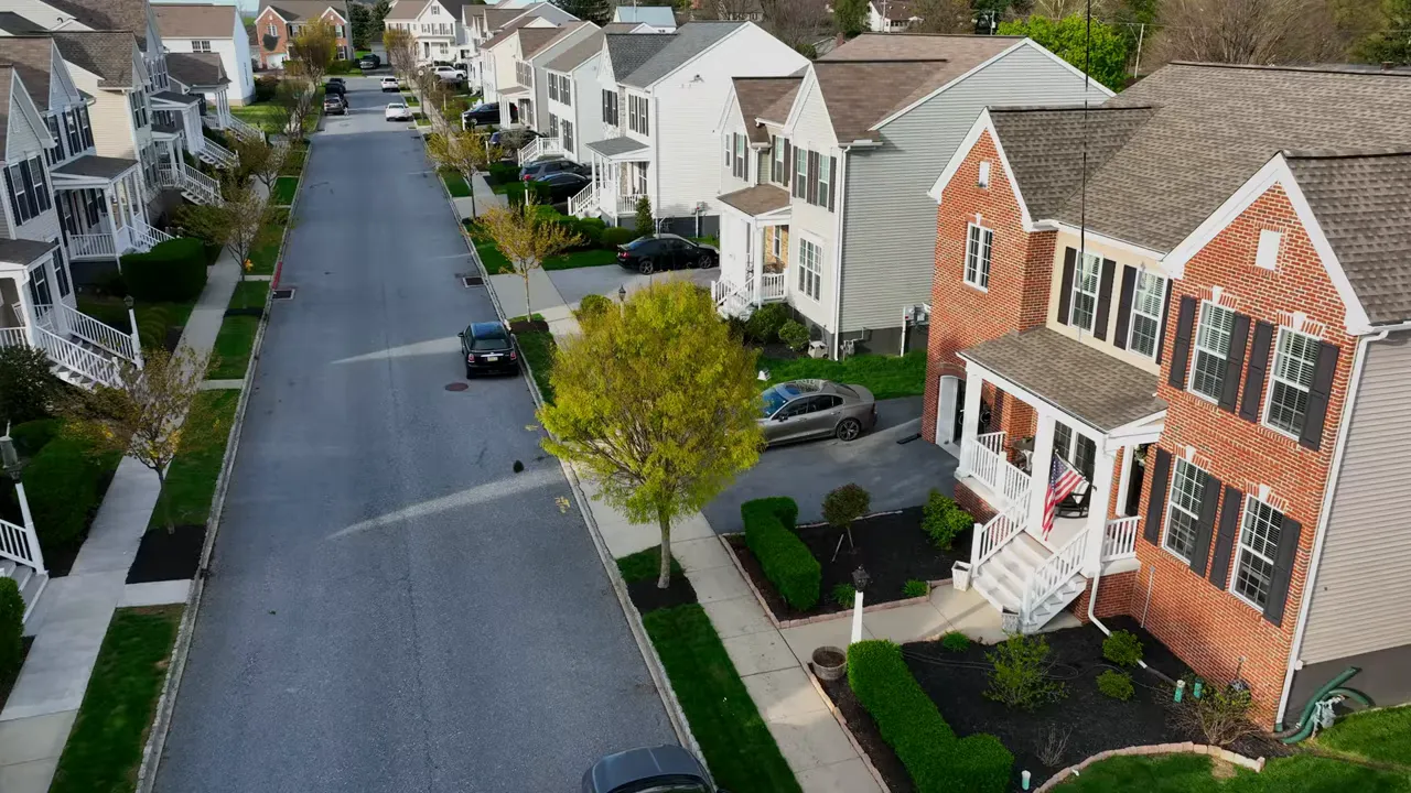 Aerial view of a new construction neighborhood street with homes in North Texas