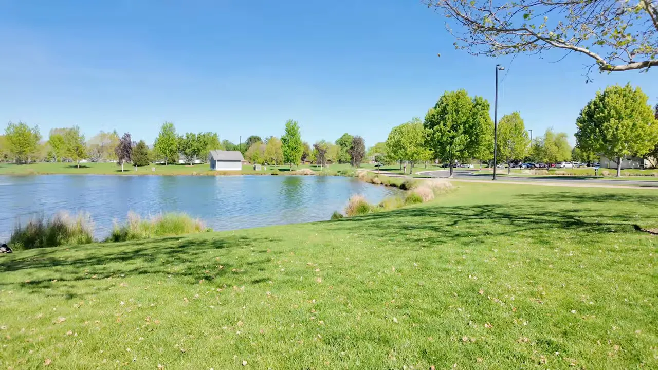 Lakeside park view in Meridian Idaho with green grass and trees