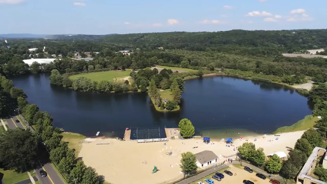 Expansive aerial view of Horseshoe Lake beach and park grounds in Roxbury, New Jersey