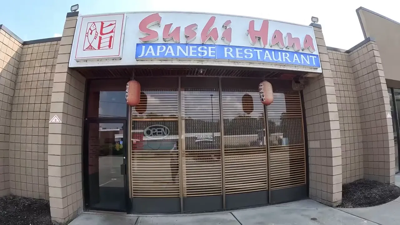 Exterior of Sushi Hana Japanese restaurant with open sign