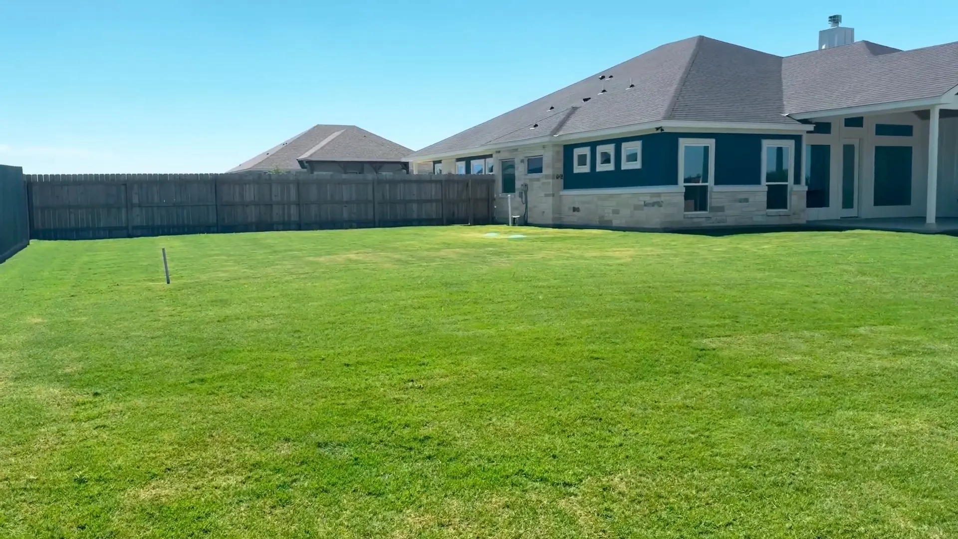 Lot prepared for future shop with clear lawn space