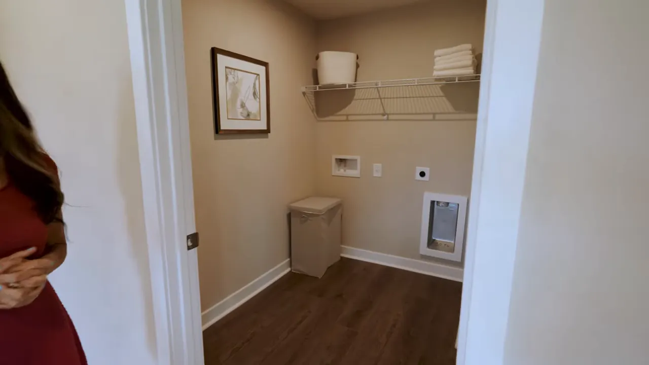 Utility room with shelving small cabinet and mechanical access area