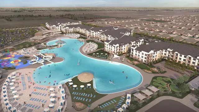 Aerial rendering of a blue lagoon surrounded by apartments and amenities