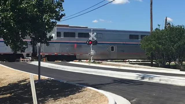 Train blocking a road at a railroad crossing
