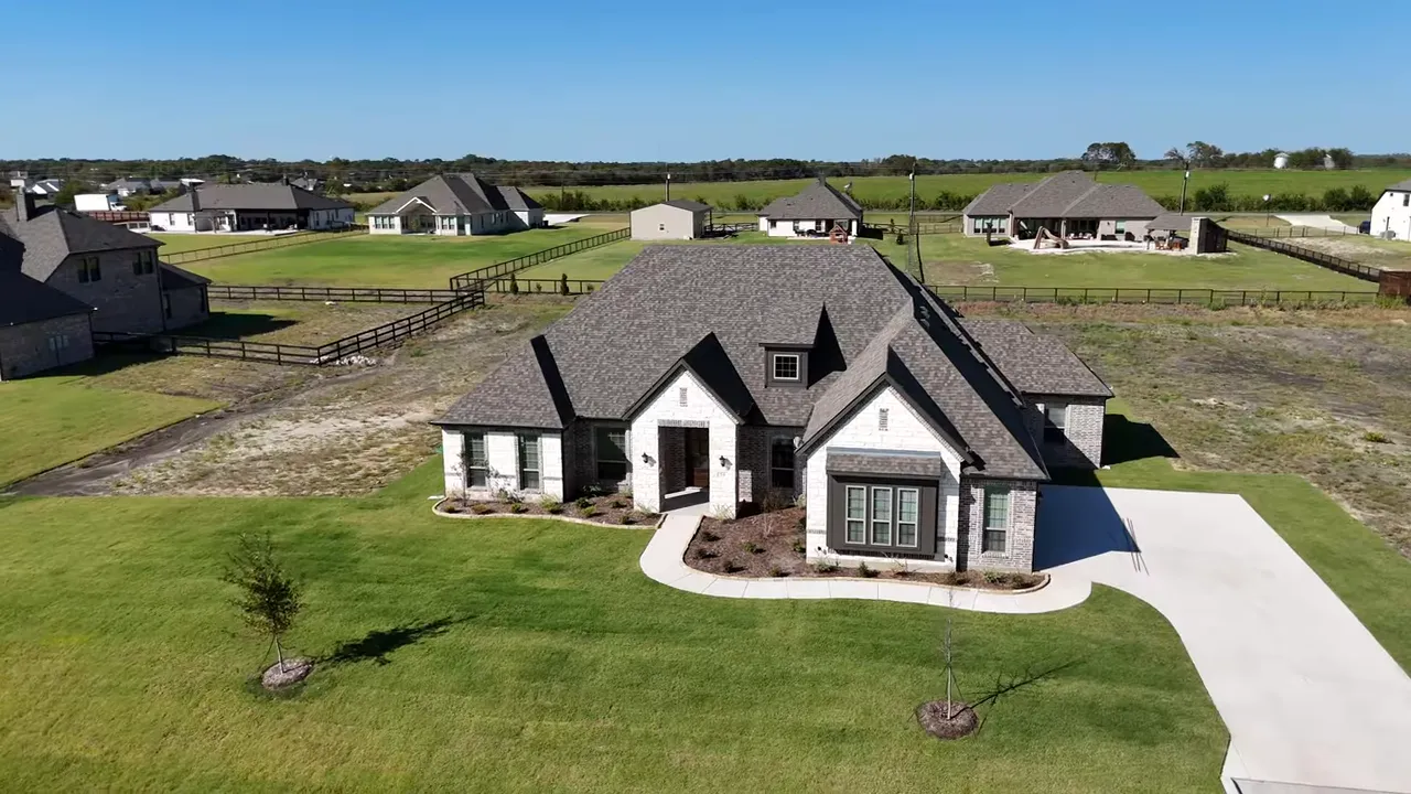 Aerial front view of the Castlebury model at Stonehollow on a one acre lot