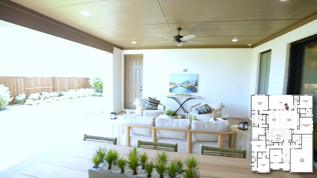 Covered patio with dining table seating ceiling fans and outdoor lounge furniture