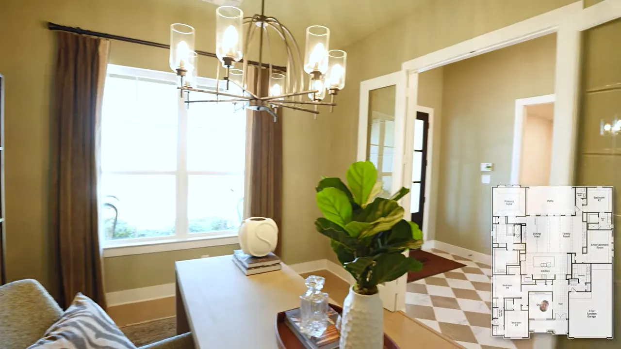 Study with shelving desk and glass double doors opening to a checkerboard foyer