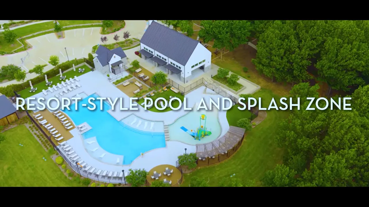 Aerial view of resort style pool with text reading resort style pool and splash zone