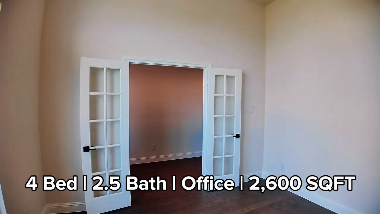 Office with French doors open and tall ceilings