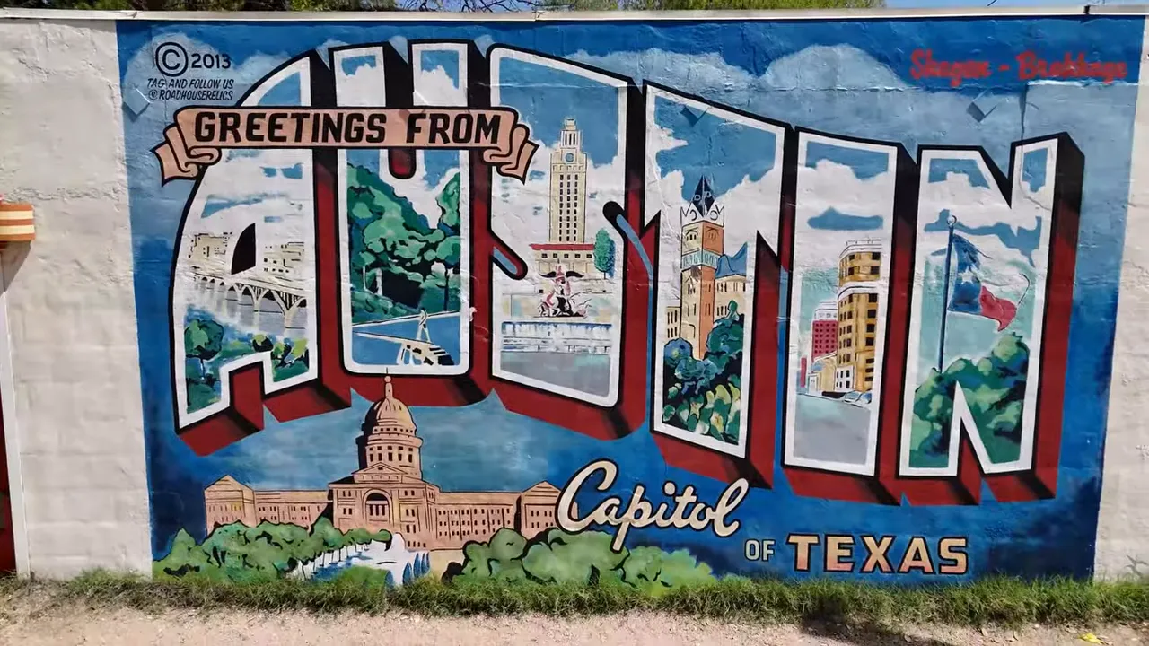 Large colorful 'Greetings From Austin' mural showing Austin landmarks and the Texas capitol