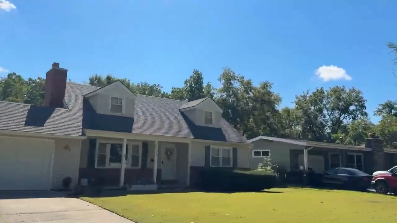 Broadview neighborhood ranch-style home exterior in Warrensburg, Missouri with blue sky and trees