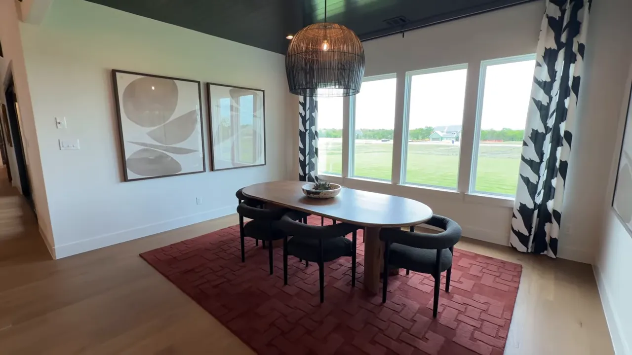 Lancaster one-story model breakfast nook with large windows overlooking green space in McLendon-Chisholm TX