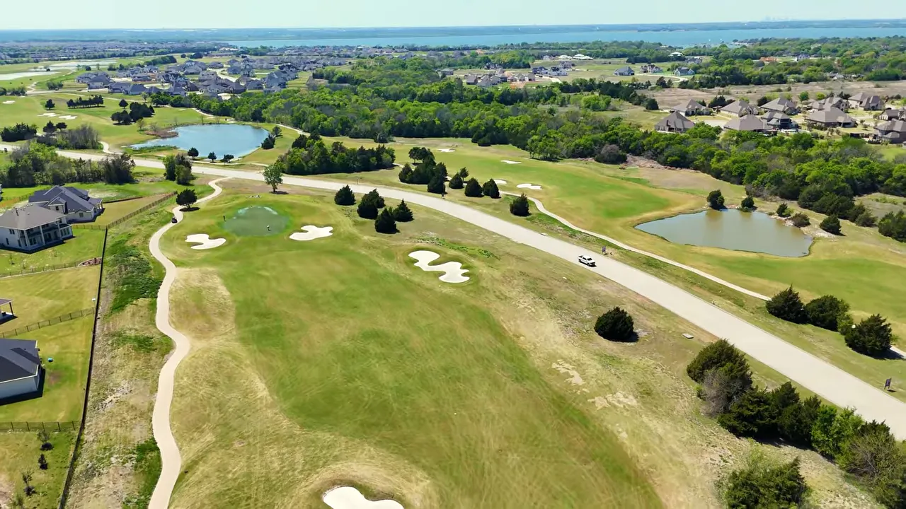 Aerial view of Heath Golf & Yacht Club golf course with water features and fairways