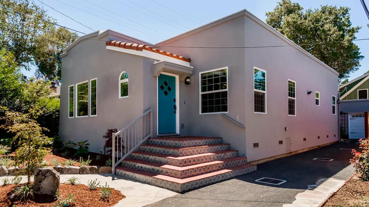 House front and driveway showing property edge and tiled front steps, good example for survey discussion