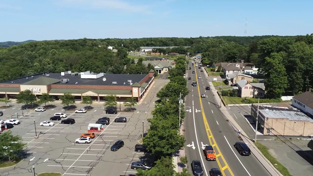 Aerial view of Sussex Turnpike with strip mall parking lots and roadside businesses