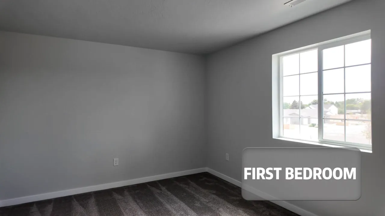 New construction first bedroom interior with large window and labeled text