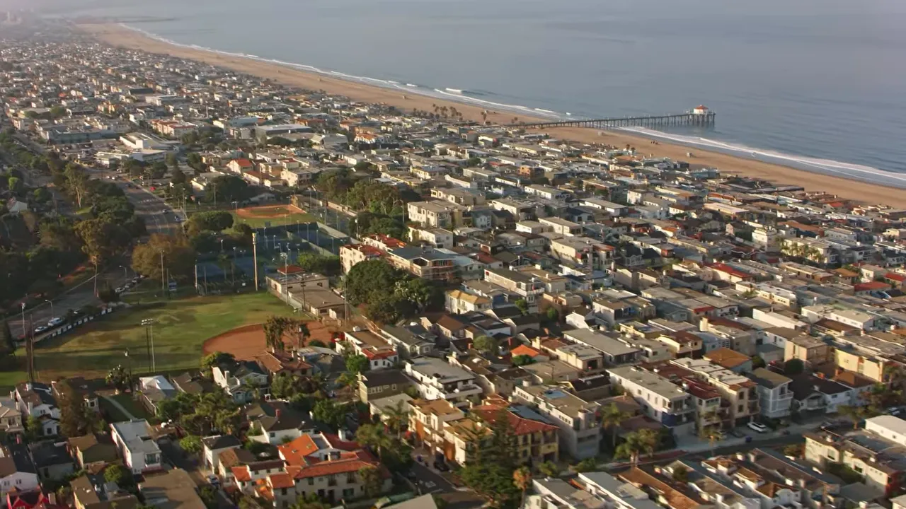 Aerial view of Southern California coastal homes near the beach and pier