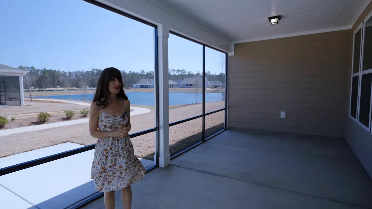 Covered porch with large windows facing the community pool area in Longs SC