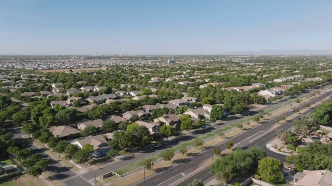 Aerial view of an established suburban neighborhood with wide roads