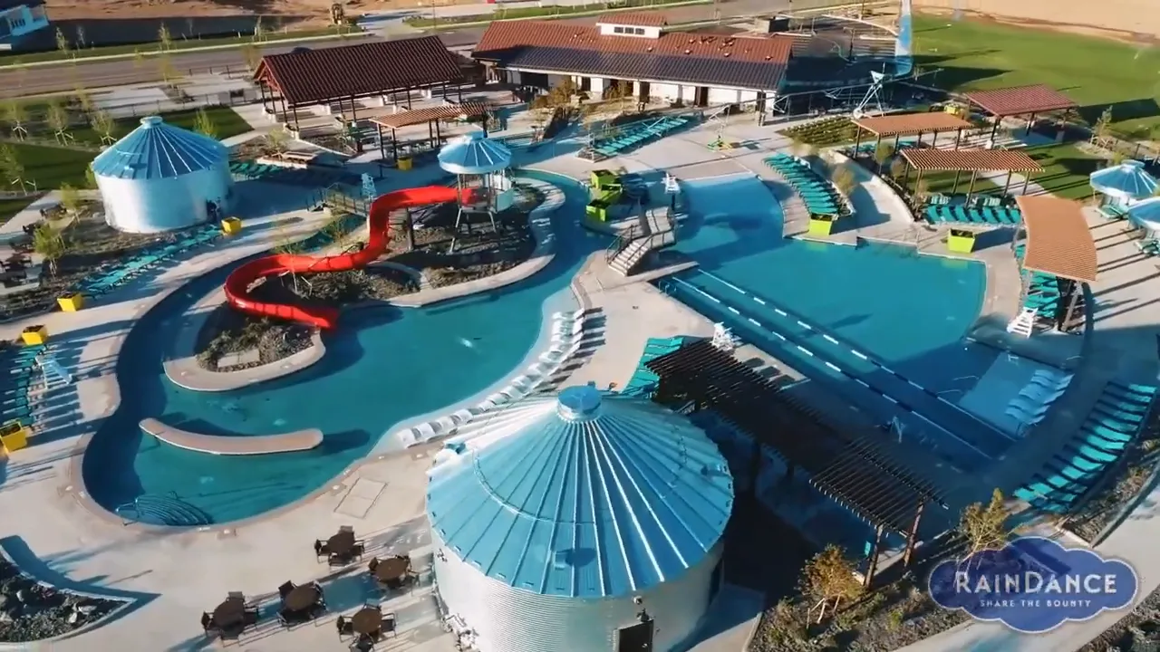 Aerial view of pool complex with slides and lazy river