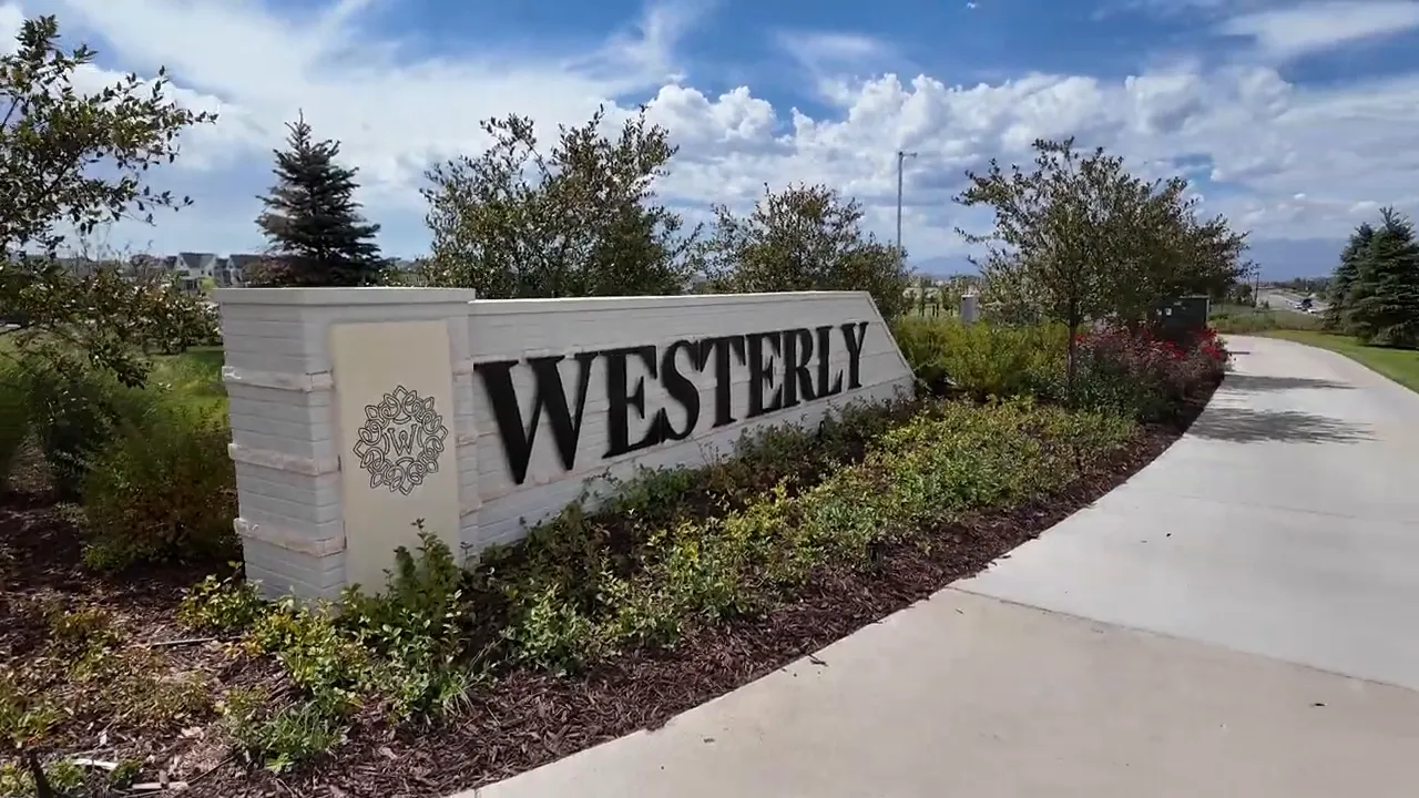 Westerly neighborhood entrance monument sign beside sidewalk