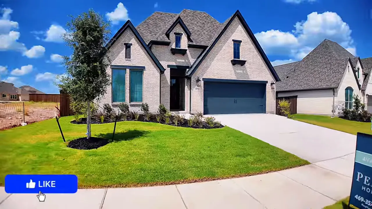 Exterior of Perry Homes 2513 with brick facade front lawn and two car garage