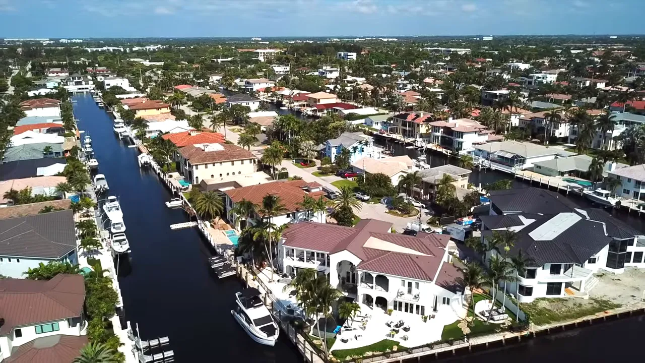 Aerial drone view of canals, private docks and waterfront homes in Bel Marra, Boca Raton