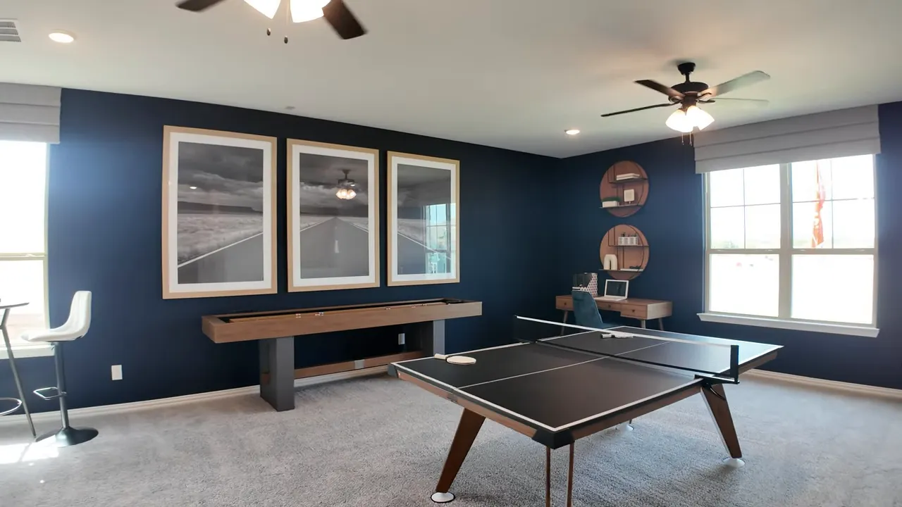 upstairs game room with ping pong table dark blue walls and large window