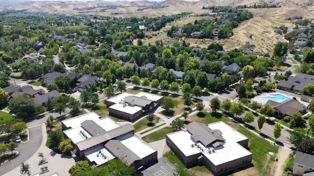 Aerial view of suburban homes in Boise, Idaho with surrounding hills