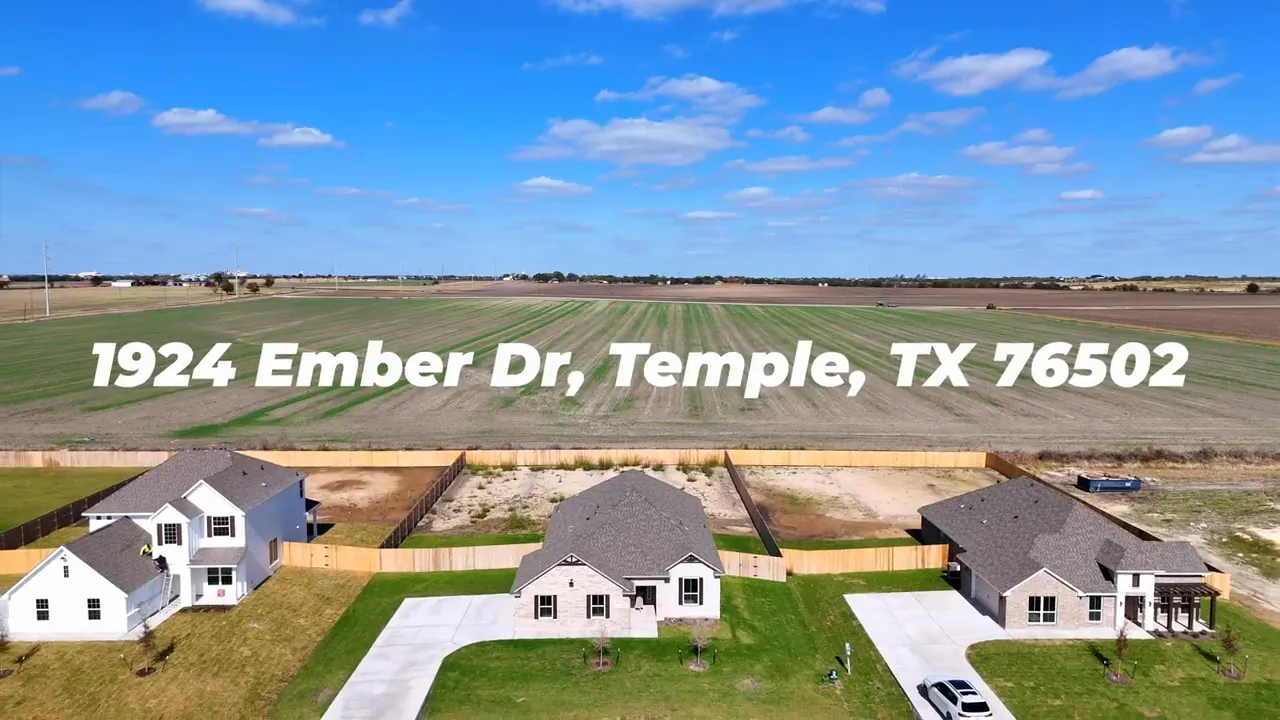 Drone shot of three homes, driveways and large open fields with overlaid text '1924 Ember Dr, Temple, TX'.
