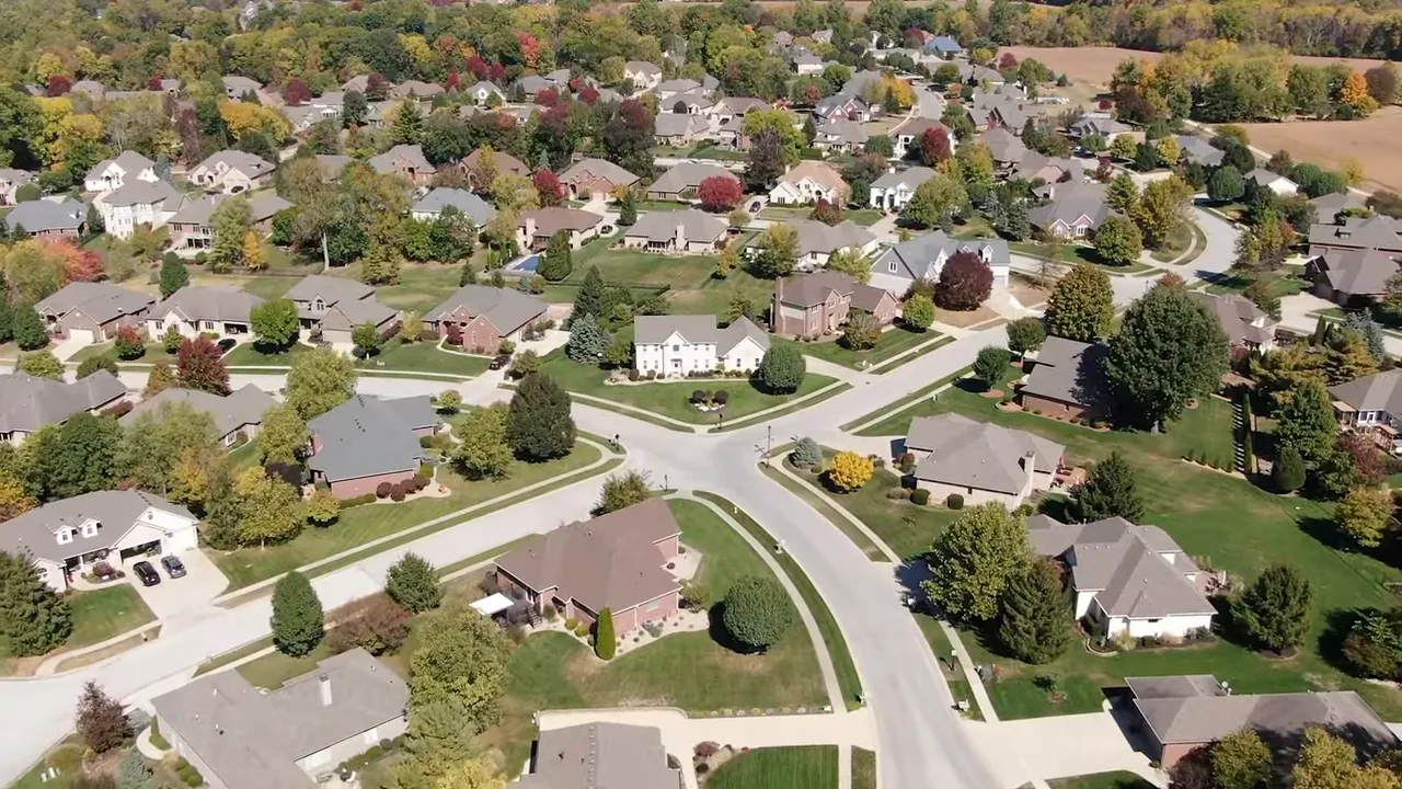Aerial view of homes and tree-lined streets in Greenwood, Indiana