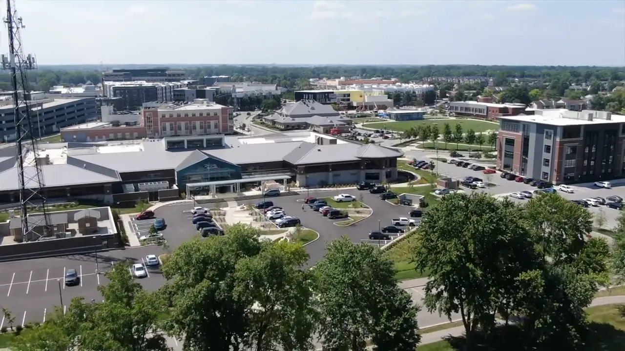 Aerial view of a Fishers Indiana mixed-use area with parking and connected pathways