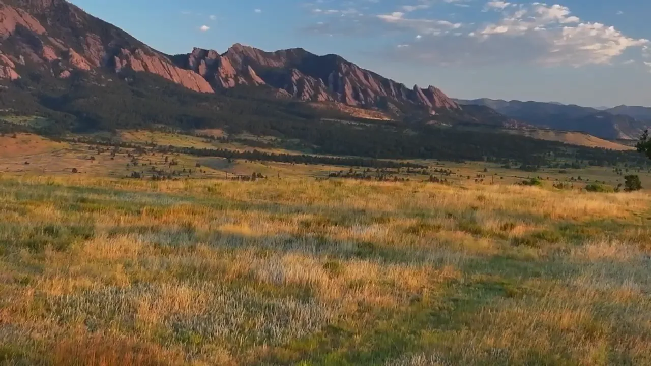 Valley landscape with mountain cliffs and open fields near Lafayette, Colorado