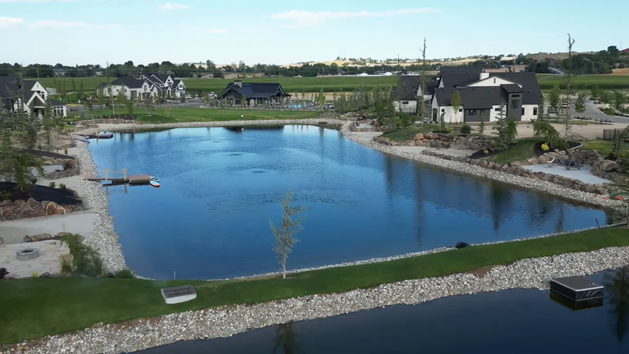 Aerial view of Terra View Eagle Idaho lake centerpiece with waterfront homes and landscaped shoreline