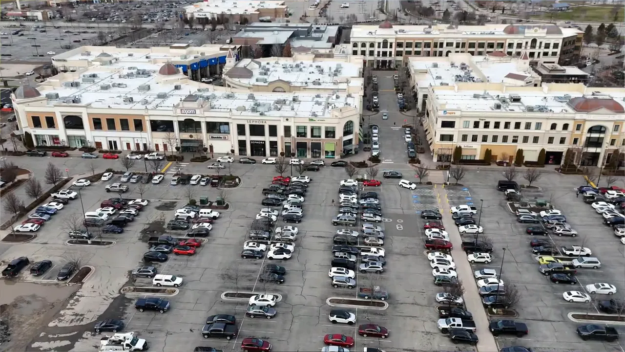 Aerial view of downtown Meridian, Idaho with retail storefronts and structured parking areas