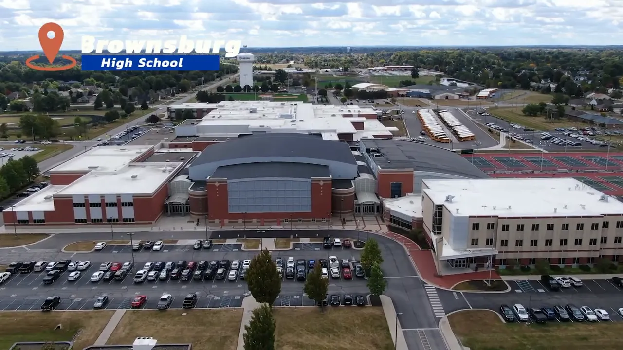 Aerial view of Brownsburg High School campus with surrounding buildings and parking lots