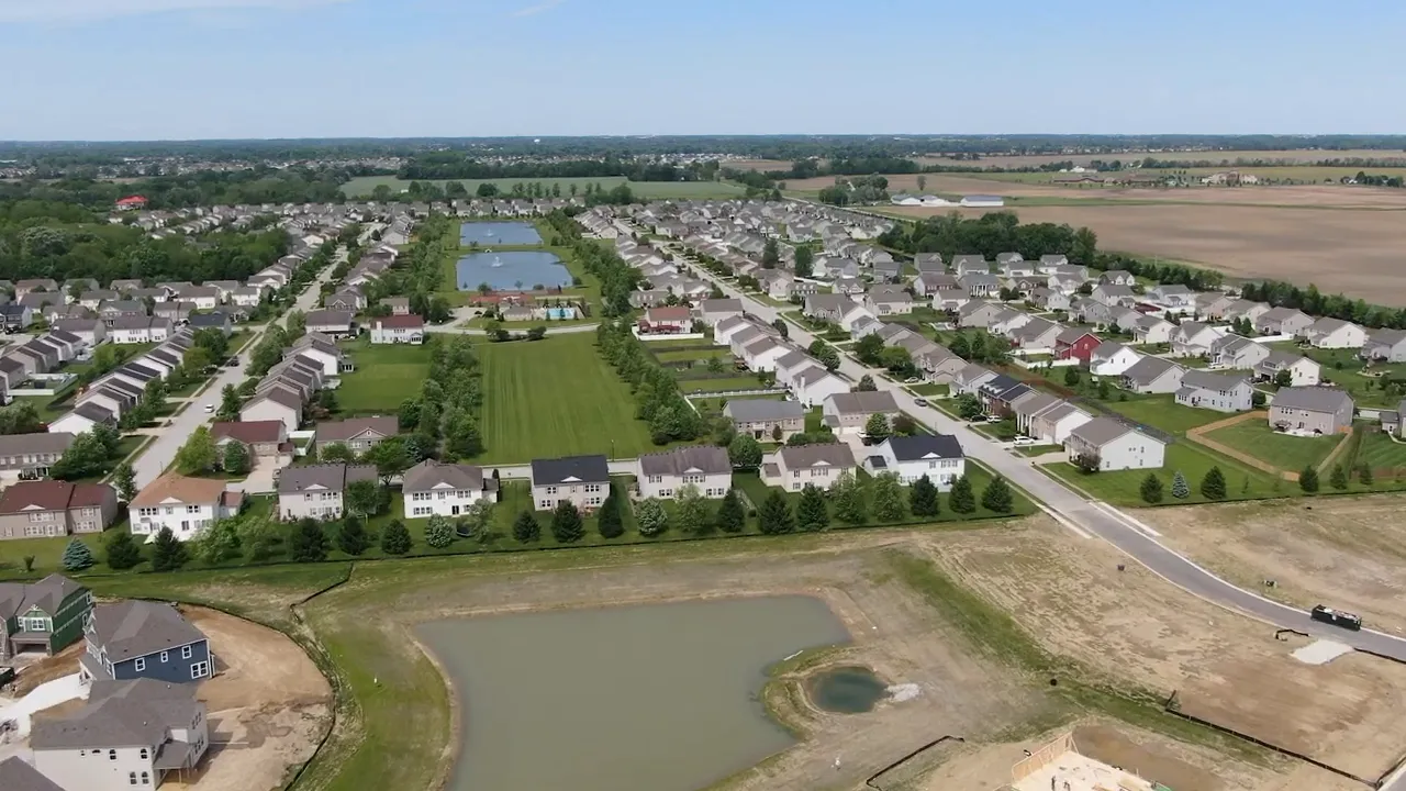 Aerial view of a large newer subdivision with ponds and recently built homes in Brownsburg