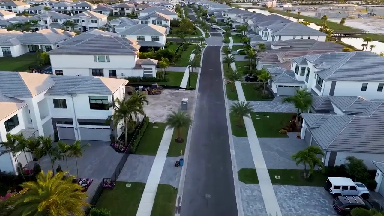 Aerial view of new homes and streets in Avenir 55+ community in Palm Beach Gardens Florida