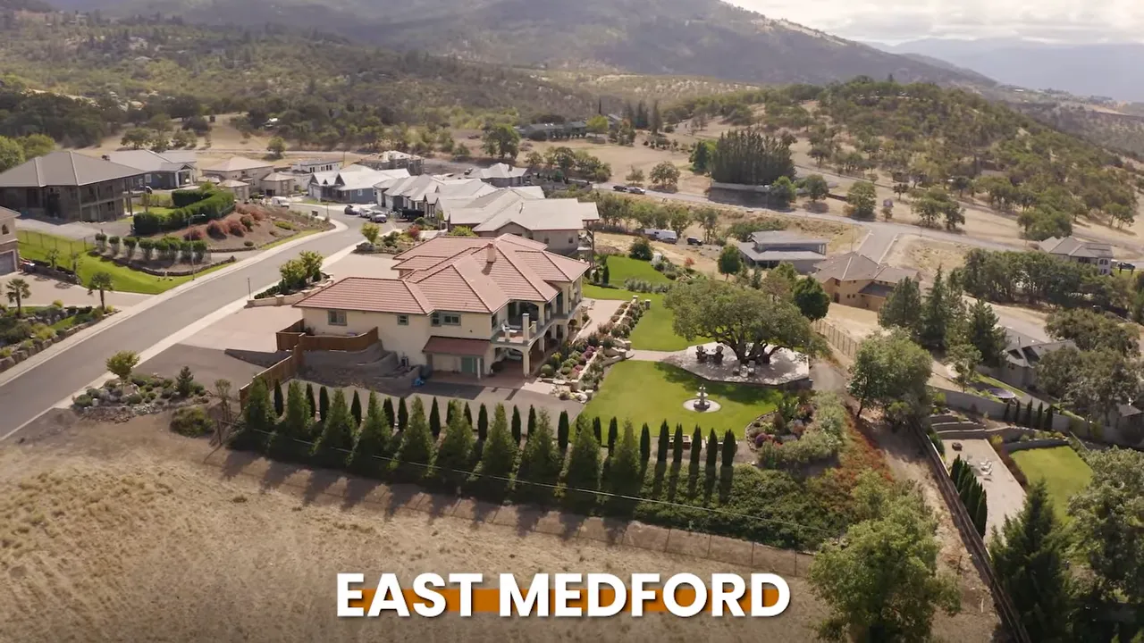 Aerial view labeled East Medford showing large homes and hillside lots