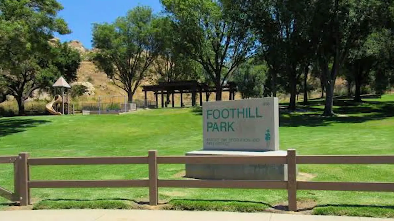 Columbine Valley monument sign surrounded by lawn and large trees