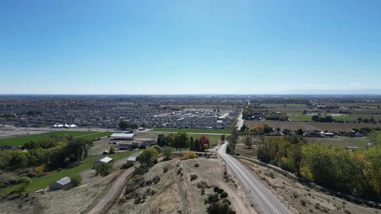 Aerial landscape view showing neighborhoods and open farmland near Middleton, Idaho