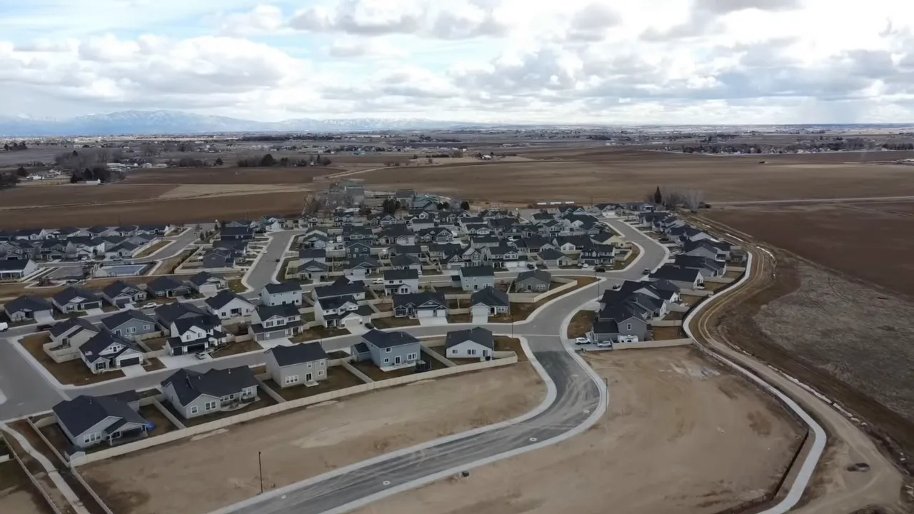 Aerial view of a new Kuna neighborhood surrounded by open farmland