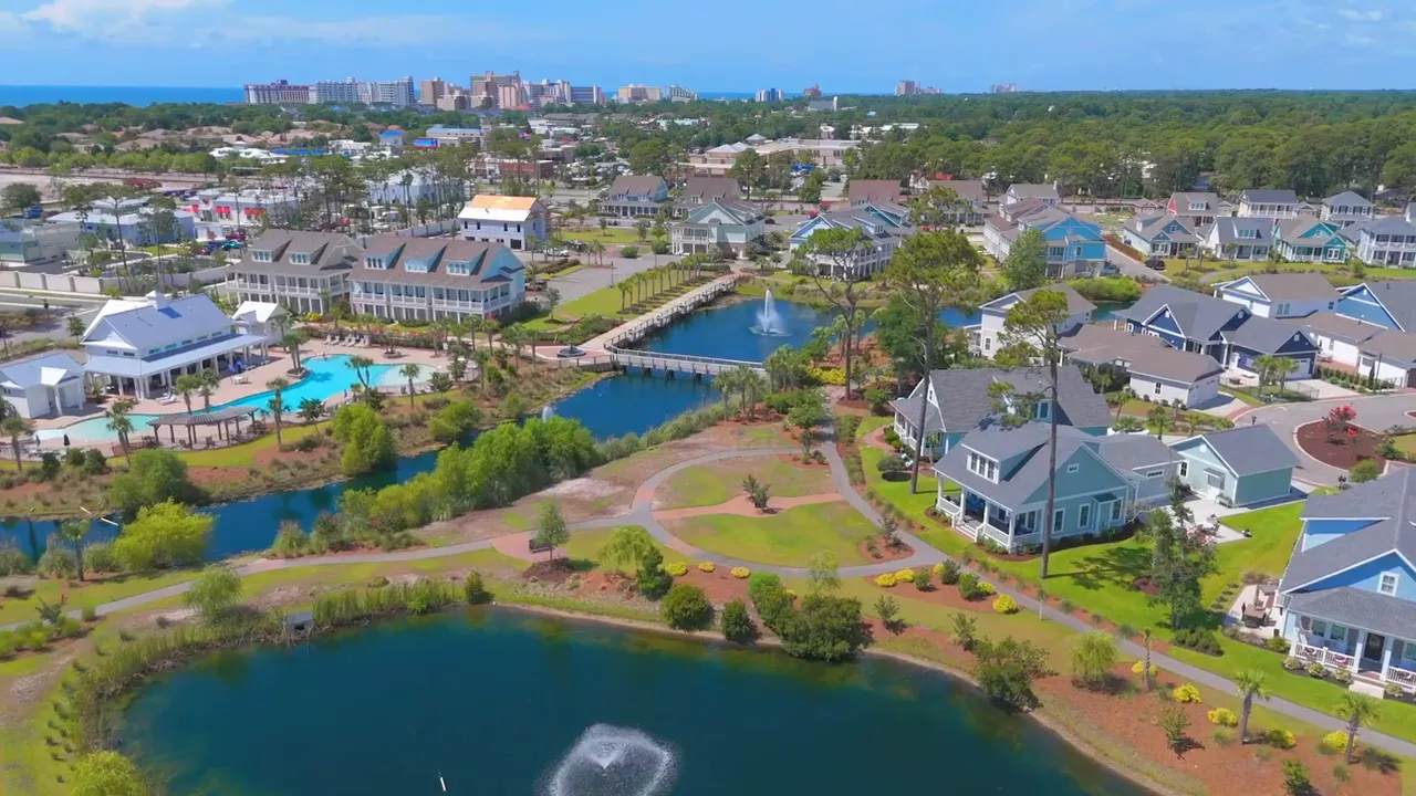 High-resolution aerial panorama of Myrtle Beach area showing houses, pools and ponds