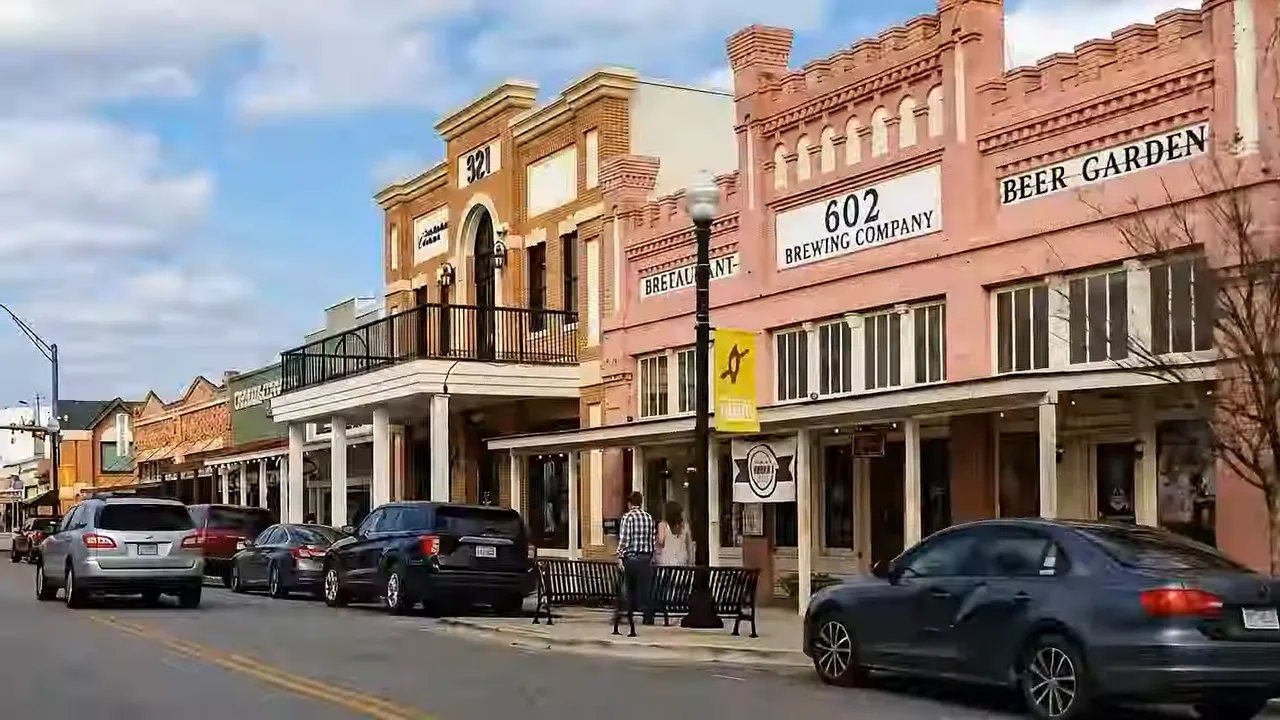 Historic Bastrop downtown storefronts along a tree lined street