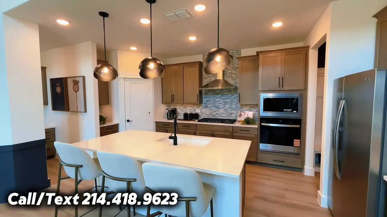 Kitchen with large island, pendant lights, wood cabinets, gas cooktop, vent hood, and built-in ovens