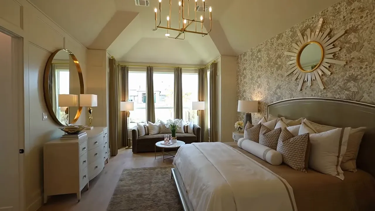 Primary bedroom sitting bay with five-pane windows and hardwood floors