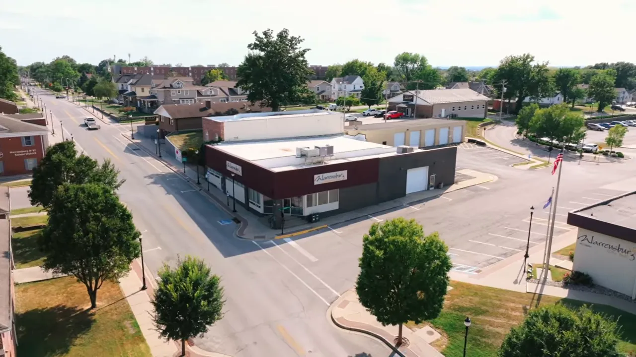 Aerial view of downtown Holden, Missouri commercial buildings and parking lots