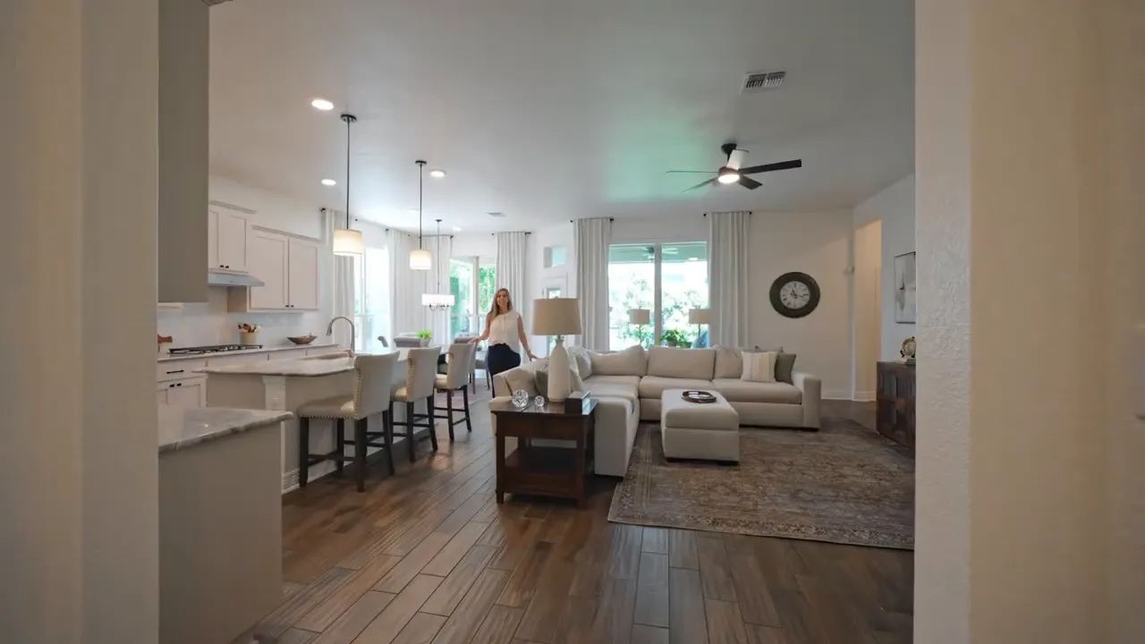 Open concept living room and kitchen view from the entry hallway